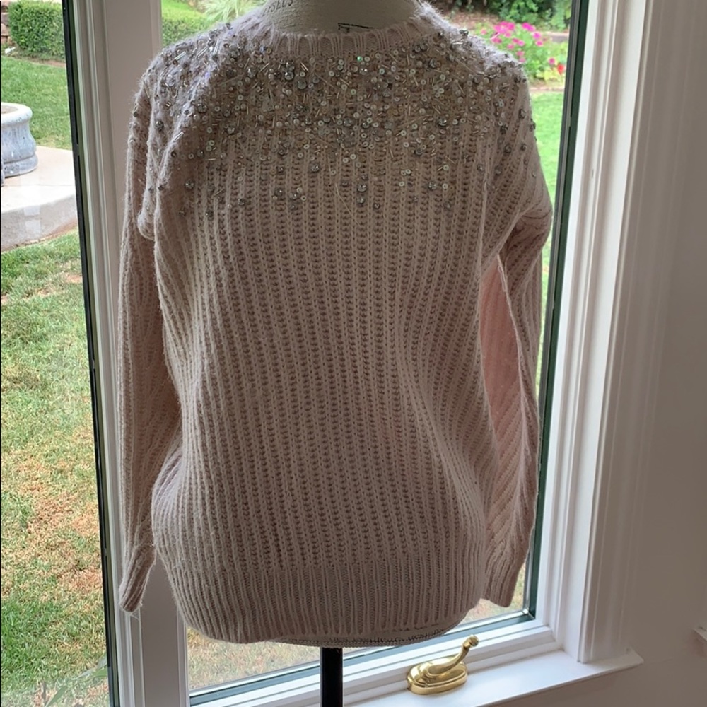 Light pink knitted blouse